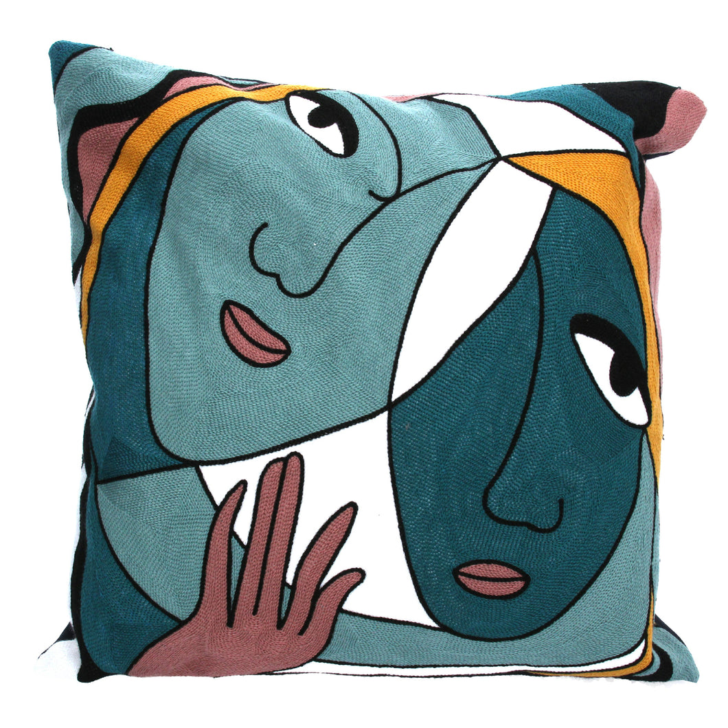 Embroidered abstract faces pillow